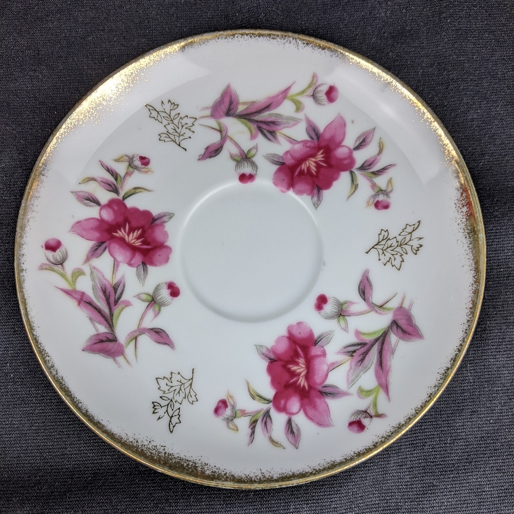 Vintage unmarked floral saucer with gold edge